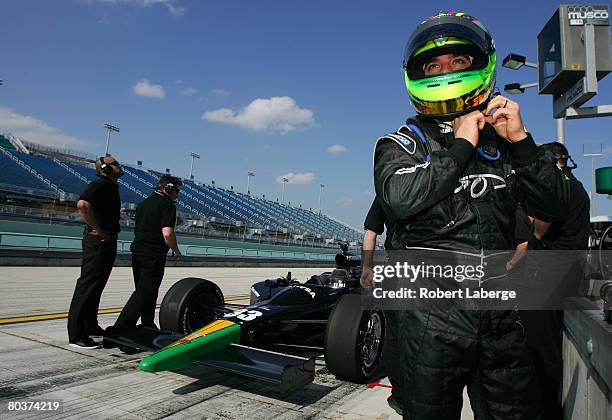 Ernesto Viso driver of the HVM Racing Dallara Honda puts his helmet on during testing for the IndyCar Series at the Homestead-Miami Speedway March...