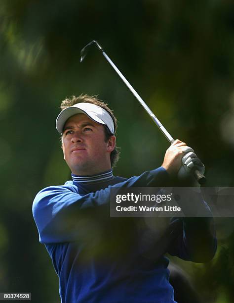 Graeme McDowell of Northern Ireland and the Lake Nona team plays his second shot into the fourth green during the second day of the Tavistock Cup at...