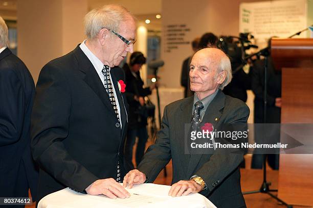 Wolfgang Paul and Detmmar Cramer talk in front of the gala of German football legends at the Konzerthaus on March 25, 2007 in Freiburg, Germany. The...