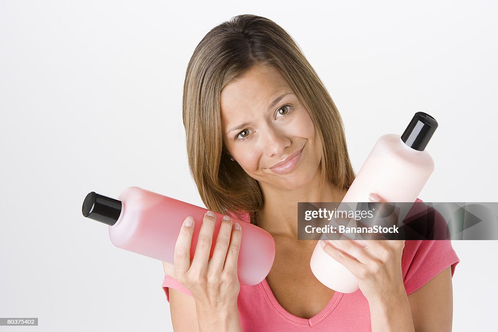 Woman with shampoo and conditioner