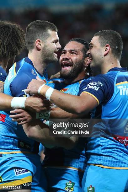 Anthony Don of the Titans celebrates after scoring a try with team mates during the round 17 NRL match between the Gold Coast Titans and the St...