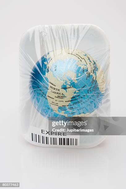 earth wrapped in cellophane - expiry date stock pictures, royalty-free photos & images