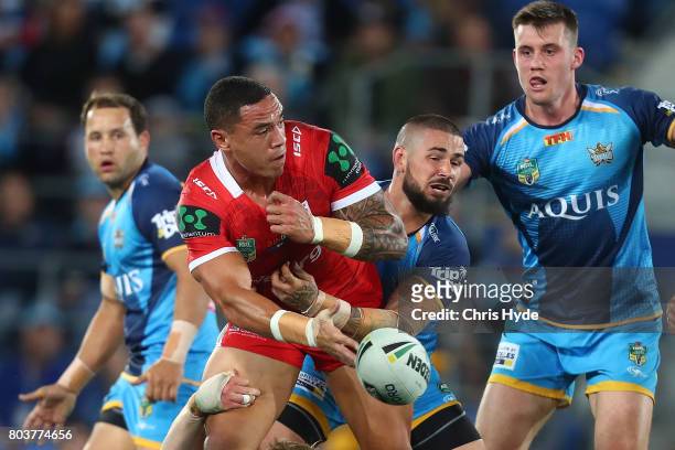 Tyson Frizell of the Dragons is tackled during the round 17 NRL match between the Gold Coast Titans and the St George Illawarra Dragons at Cbus Super...