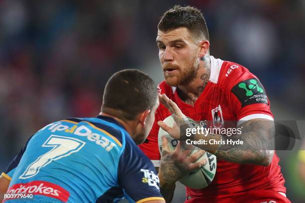 Josh Dugan of the Dragons runs the ball during the round 17 NRL match between the Gold Coast Titans and the St George Illawarra Dragons at Cbus Super...