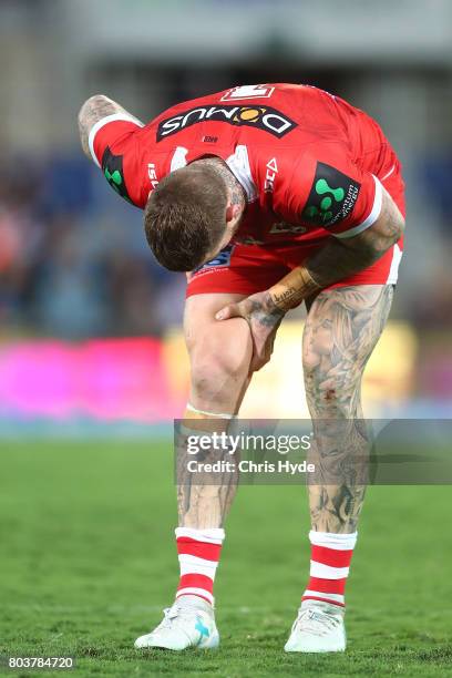 Josh Dugan of the Dragons leaves the field injured during the round 17 NRL match between the Gold Coast Titans and the St George Illawarra Dragons at...