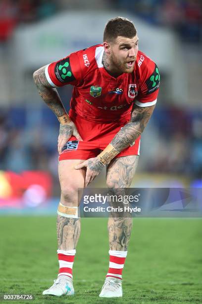 Josh Dugan of the Dragons leaves the field injured during the round 17 NRL match between the Gold Coast Titans and the St George Illawarra Dragons at...
