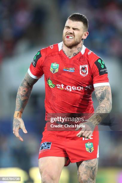 Josh Dugan of the Dragons leaves the field injured during the round 17 NRL match between the Gold Coast Titans and the St George Illawarra Dragons at...