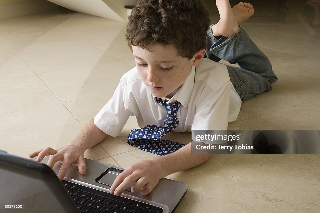 Boy with laptop computer