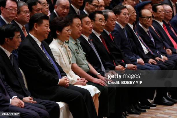 China's President Xi Jinping and Hong Kong's incoming chief executive, Carrie Lam , attend a photo session with guests during Xi's visit in Hong Kong...
