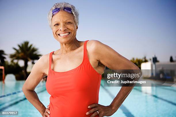 smiling senior woman swimmer - women in bathing suits stock pictures, royalty-free photos & images