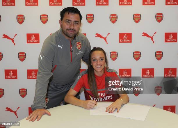 Arsenal Ladies latest signing Lisa Evans poses with Arsenal Ladies Manager Pedro Martinez Losa during a photocall at London Colney on May 16, 2017 in...