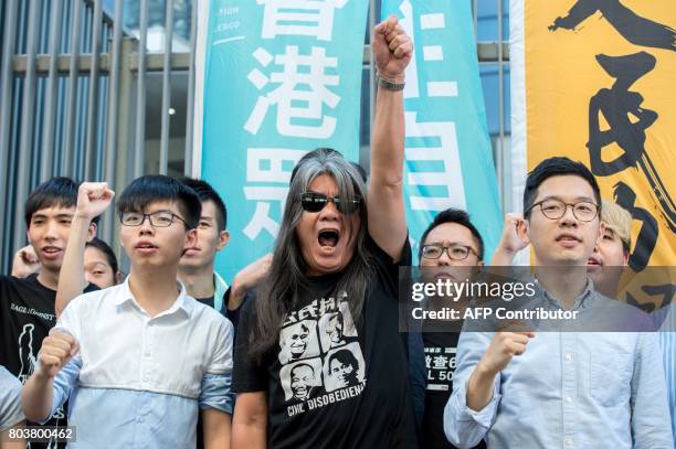 Student protest leader Joshua Wong , pro-democracy lawmaker Leung Kwok-hung , also known as "Long Hair", and pro-democracy lawmaker Nathan Law hold a...