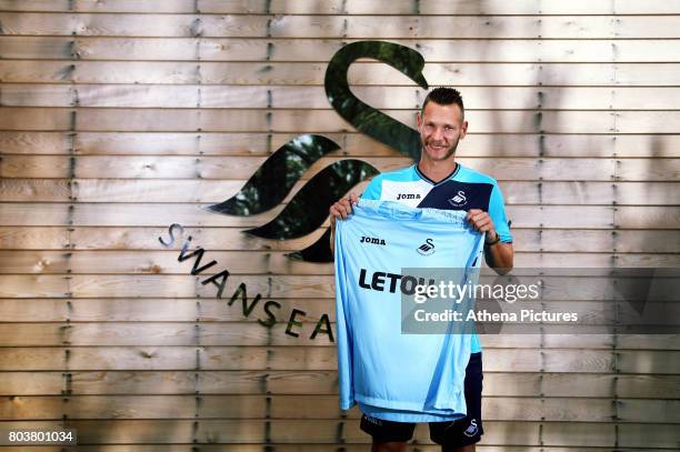 Erwin Mulder holds a shirt at the Swansea City Training at The Fairwood Training Ground on June 19, 2017 in Swansea, Wales.