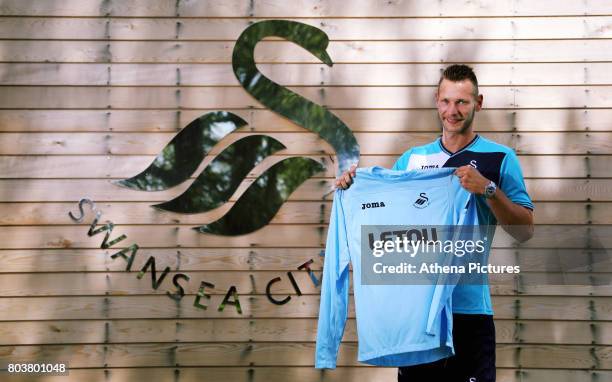 Erwin Mulder holds a shirt at the Swansea City Training at The Fairwood Training Ground on June 19, 2017 in Swansea, Wales.