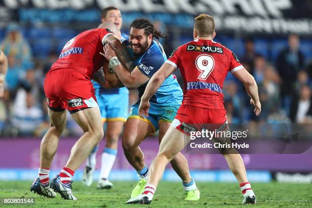 Konrad Hurrell of the Titans is tackled during the round 17 NRL match between the Gold Coast Titans and the St George Illawarra Dragons at Cbus Super...