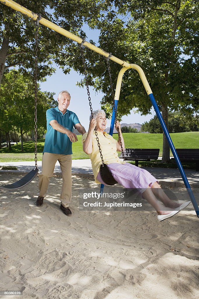 Senior couple with swing set