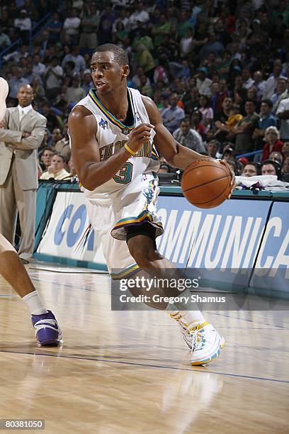 Chris Paul of the New Orleans Hornets moves the ball during the NBA game against the Chicago Bulls on March 17, 2008 at the New Orleans Arena in New...