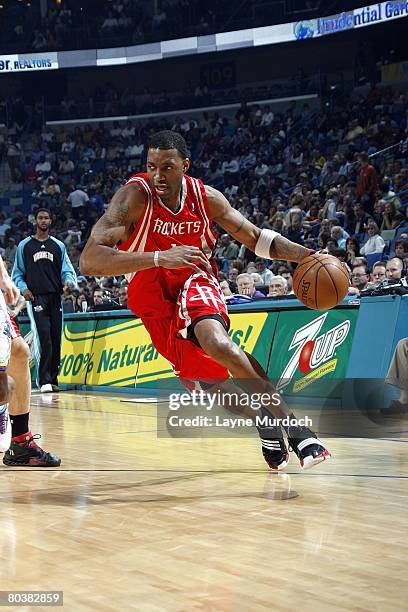 Tracy McGrady of the Houston Rockets moves the ball during the NBA game against the New Orleans Hornets at the New Orleans Arena on February 22, 2008...