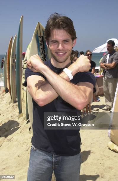 James Marsden star of the film X-Men gives a X-sign for photographers, July 7, 2000 at the Movieline Beach Party in Pacific Palisades, CA