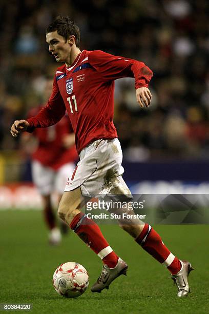 England player Adam Johnson runs with the ball during the Under-21 International Friendly between England and Poland at Molineux on March 25, 2008 in...