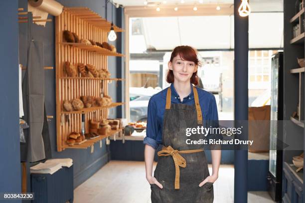 baker in artisan bakery - bakery apron bildbanksfoton och bilder