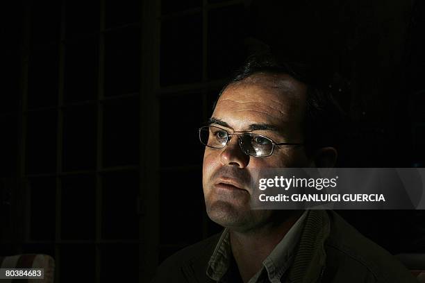 South African farmer Stephen Hoffman explains the legal procedures to hire Zimbabwean workers on March 17, 2008 on his farm at Waterpoort in South...