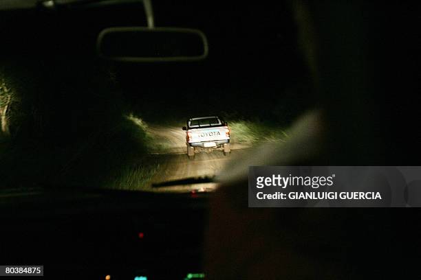 South African farmers patrol on March 17, 2008 the farming area of Waterpoort in South Africa in search of Zimbabwean illegal immigrants stealing and...