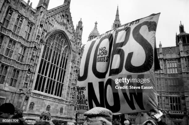 Demonstration outside Parliament on the day unemployment figures reached 3 million, February 1993. A banner reads, 'Homes and Jobs Now, No Job...