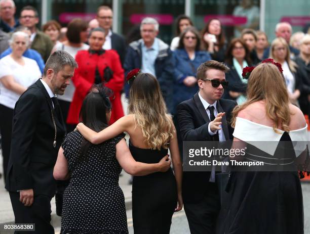 Martyn Hett's partner Russell Hayward greets mourners as the arrive for the funeral of Martyn Hett at Stockport Town Hall on June 30, 2017 in...