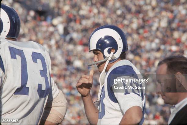 Roman Gabriel of the Los Angeles Rams watches from the sideline during an NFL game against the Green Bay Packers at the Los Angeles Memorial Coliseum...