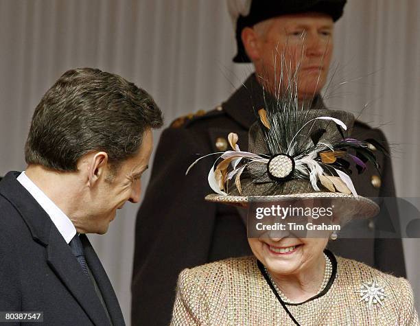 French President Nicolas Sarkozy chats with Queen Elizabeth II during a welcome ceremony at Windsor Castle on the first day of his State Visit on...