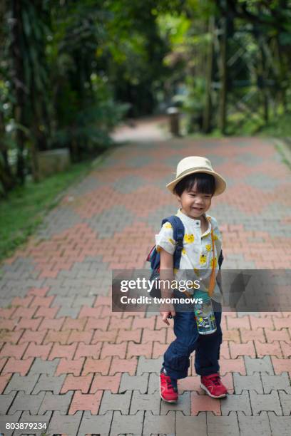 asian toddler in filed trip. - jurong bird park stock pictures, royalty-free photos & images