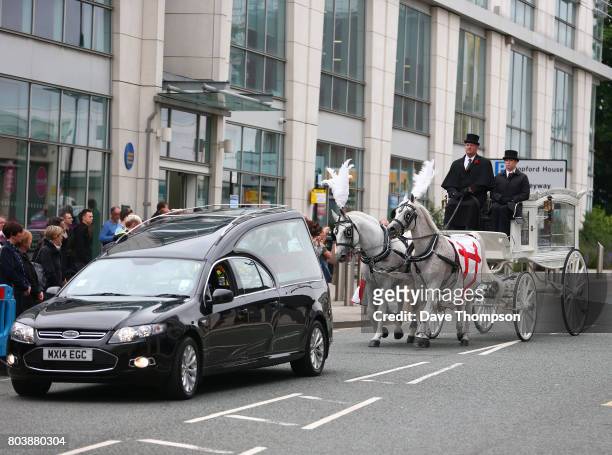 The coffin of Martyn Hett arrives at Stockport Town Hall for his funeral service in a white horse drawn carriage on June 30, 2017 in Stockport,...