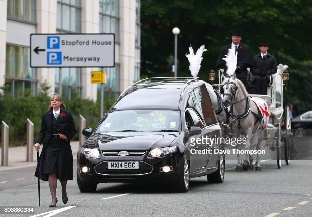 The coffin of Martyn Hett arrives at Stockport Town Hall for his funeral service in a white horse drawn carriage on June 30, 2017 in Stockport,...
