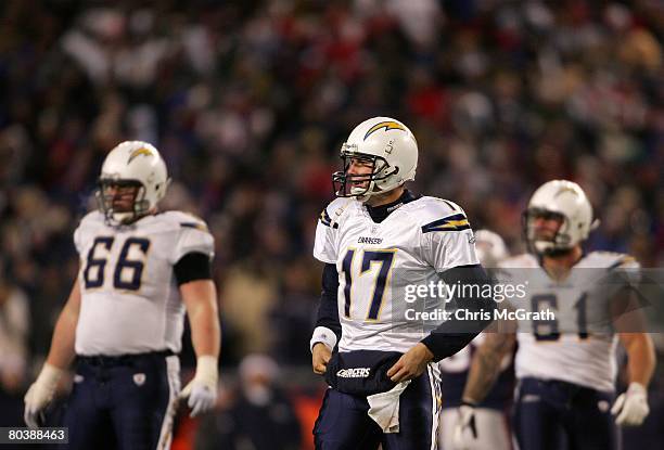 Philip Rivers, Nick Hardwick and Jeromey Clary of the San Diego Chargers looks on against the New England Patriots during the AFC Championship Game...