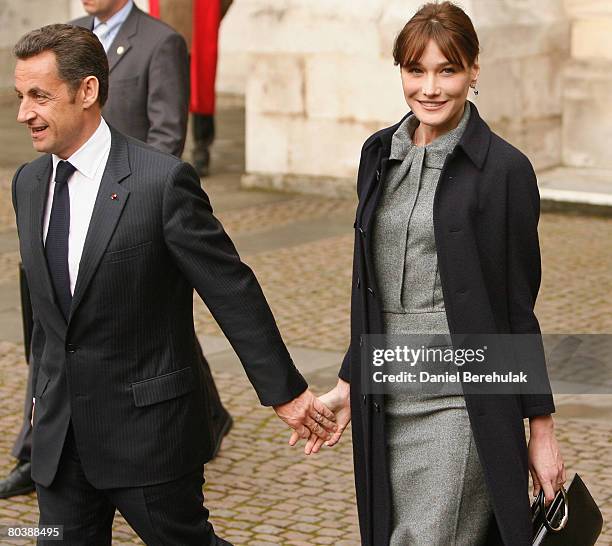 French President Nicolas Sarkozy and wife Carla Bruni-Sarkozy depart after laying a wreath at Westminster Abbey on March 26, 2008 in London, England....