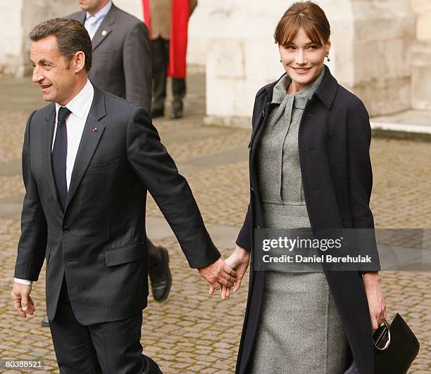 French President Nicolas Sarkozy and wife Carla Bruni-Sarkozy depart after laying a wreath at the Tomb of the Unknown Solider at Westminster Abbey on...