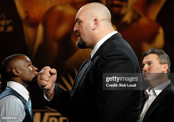 Boxer Floyd "Money" Mayweather Jr. And WWE's Big Show pose at a press conference at the Hard Rock Cafe on March 26, 2008 in New York City. The two...