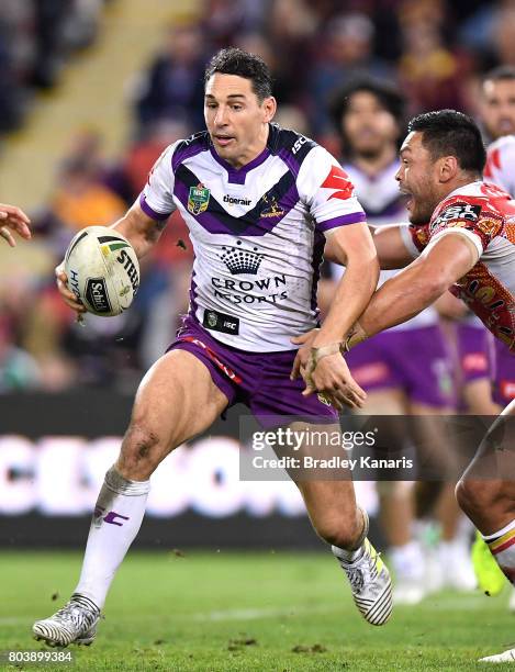 Billy Slater of the Storm breaks away from the defence during the round 17 NRL match between the Brisbane Broncos and the Melbourne Storm at Suncorp...