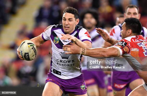 Billy Slater of the Storm breaks away from the defence during the round 17 NRL match between the Brisbane Broncos and the Melbourne Storm at Suncorp...