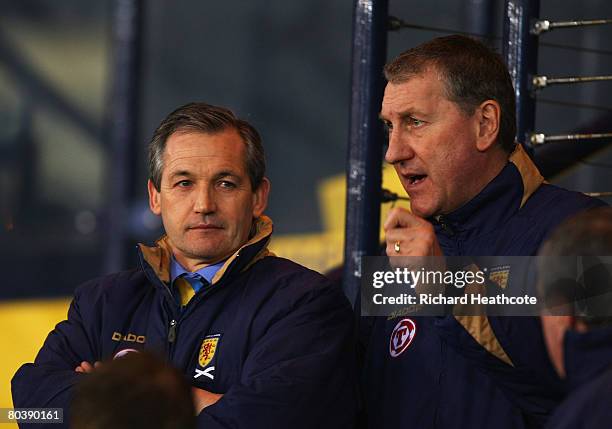 George Burley , the Scotland head coach and his assistant, Terry Butcher look on prior to kickoff during the Tennent's International Challenge...