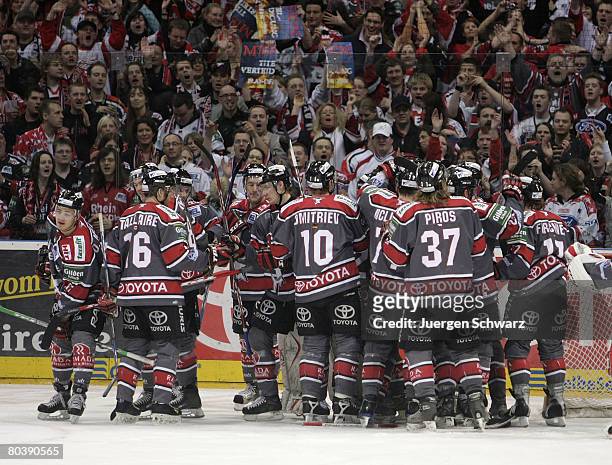 Cologne players celebrate after the DEL Play-Off match between Koelner Haie and Adler Mannheim at the KoelnArena on March 26 in Cologne, Germany....