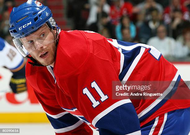 Saku Koivu of the Montreal Canadiens looks back as he prepares for a faceoff against the St. Louis Blues at the Bell Centre on March 18, 2008 in...
