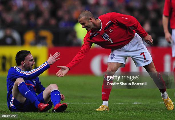 David Beckham of England shakes hands with Franck Ribery of France as he wins his 100th cap during the International Friendly match between France...