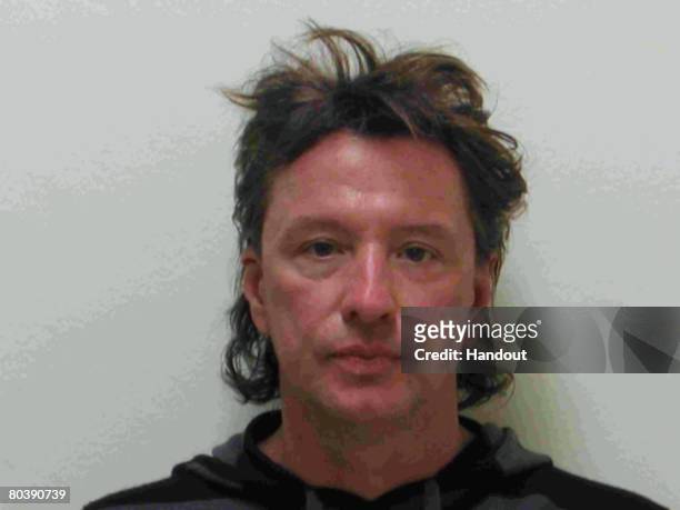 In this handout image provided by the Laguna Beach Police Department, Bon Jovi guitarist Richard Sambora poses for his mug shot March 26, 2008 in...