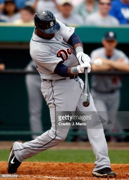 First baseman Marcus Thames of the Detroit Tigers gets into a pitch against the Pittsburgh Pirates during the Grapefruit League Spring Training game...