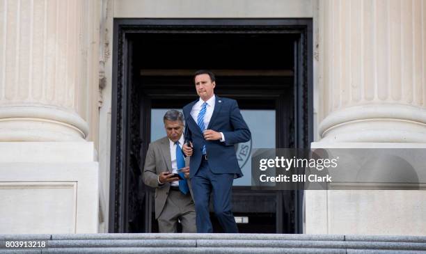 Rep. Ryan Costello, R-Pa., runs past Rep. Lou Barletta, R-Pa., on the House steps as members of Congress leave for the 4th of July recess following...