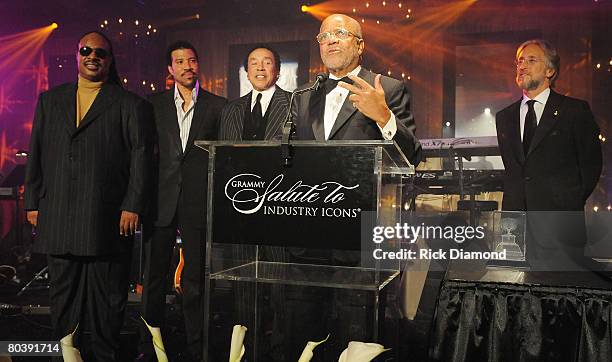 Icon Berry Gordy accepts The Grammy Industry Icon Award from Recording Academy President/CEO Neil Portnow while Stevie Wonder, Lionel Richie and...