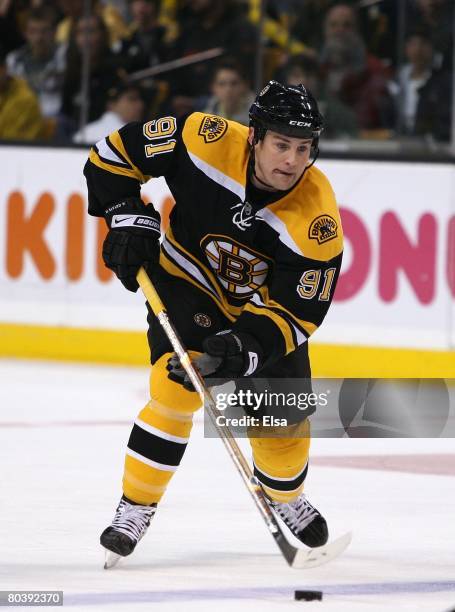 Marc Savard of the Boston Bruins carries the puck across the blueline against the Washington Capitals during their NHL game on March 8, 2008 at the...