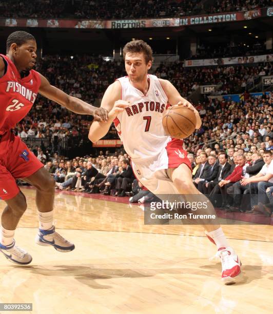 Andrea Bargnani of the Toronto Raptors drives against Amir Johnson of the Detroit Pistons on March 26, 2008 at the Air Canada Centre in Toronto,...